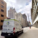 Optimal Plumbing Van at commercial job site in downtown milwaukee
