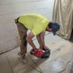Cutting through existing floor in basement floor.