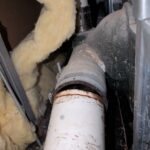 broken pipe at Target inside bathroom wall