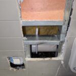 The hole we needed to cut to access broken leaking pipe